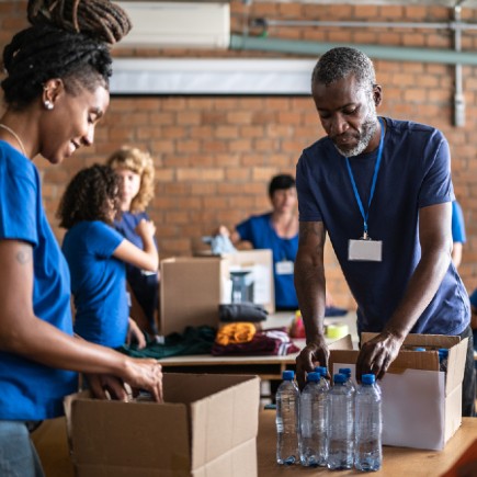 Florida Blue volunteers working a food drive in the community